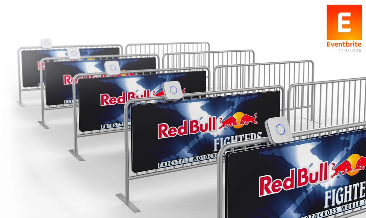 Portal scanners mounted on branded event barriers at a sponsored sports event.